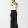 Pantalones ligeros con cordones y detalles texanos
